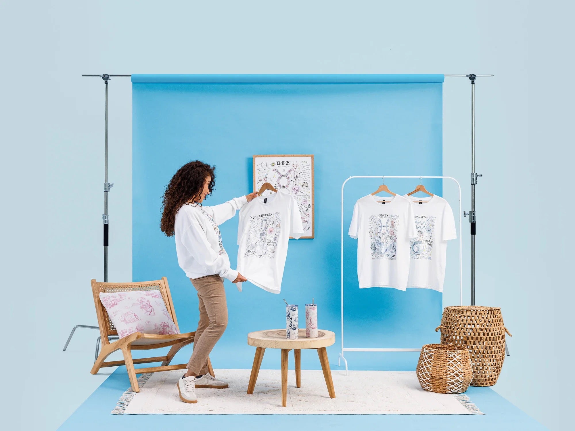 Studio backdrop, blue: printed tees, poster, cushion and tumblers